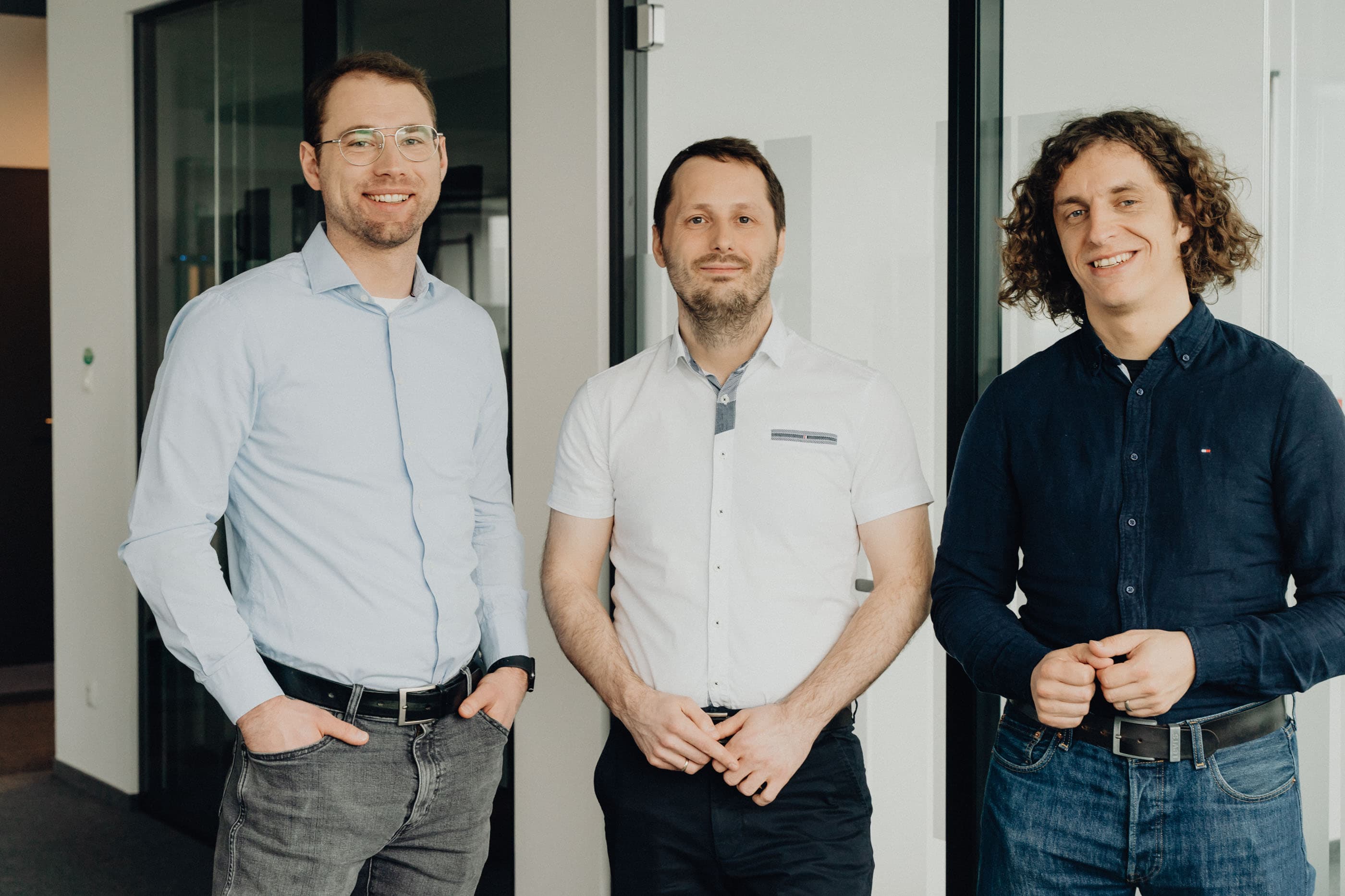 Mapbox integration visualization with developers collaborating on digital maps and data interfaces, symbolizing the advantages of partnering with certified Mapbox experts.