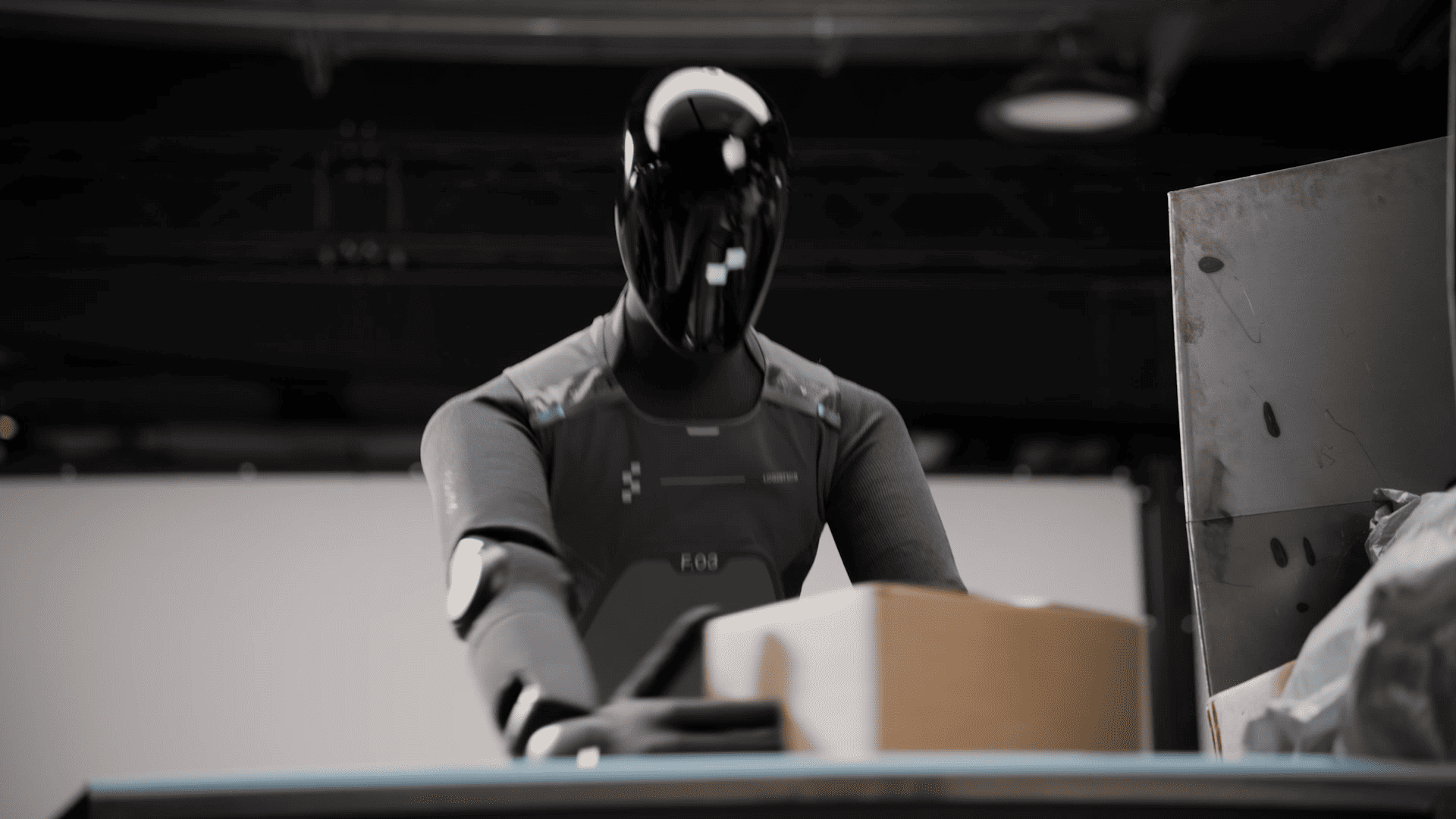 Humanoid robot Figure 03 operating autonomously in an enterprise warehouse environment, powered by Helix AI system.
